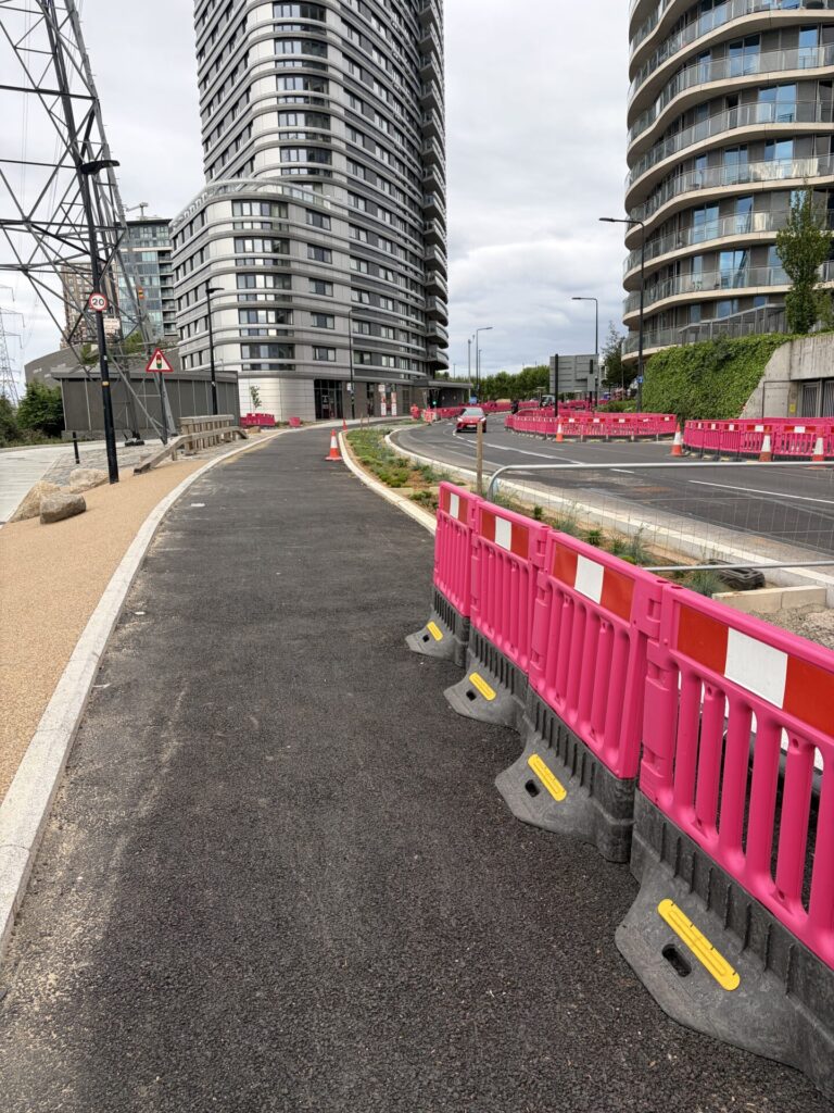 Two-way cycle track awaiting its top surface with rain gardens on the right hand side.