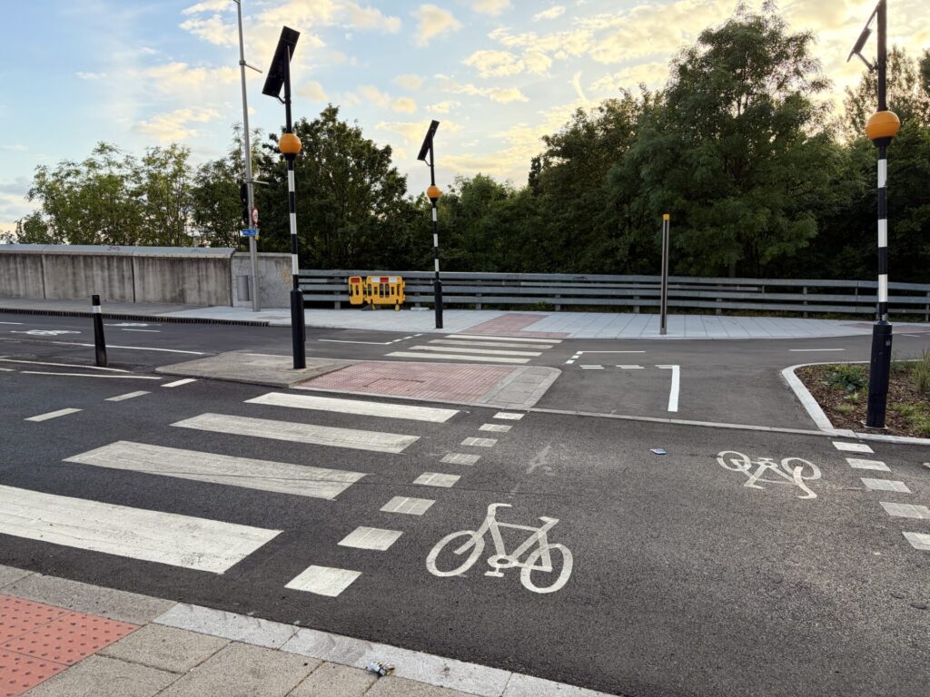 Parallel priority pedestrian and cycle crossing connecting to a cycle track on the opposite side of the road.